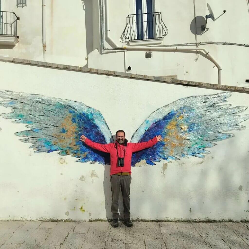 Birder with mural
